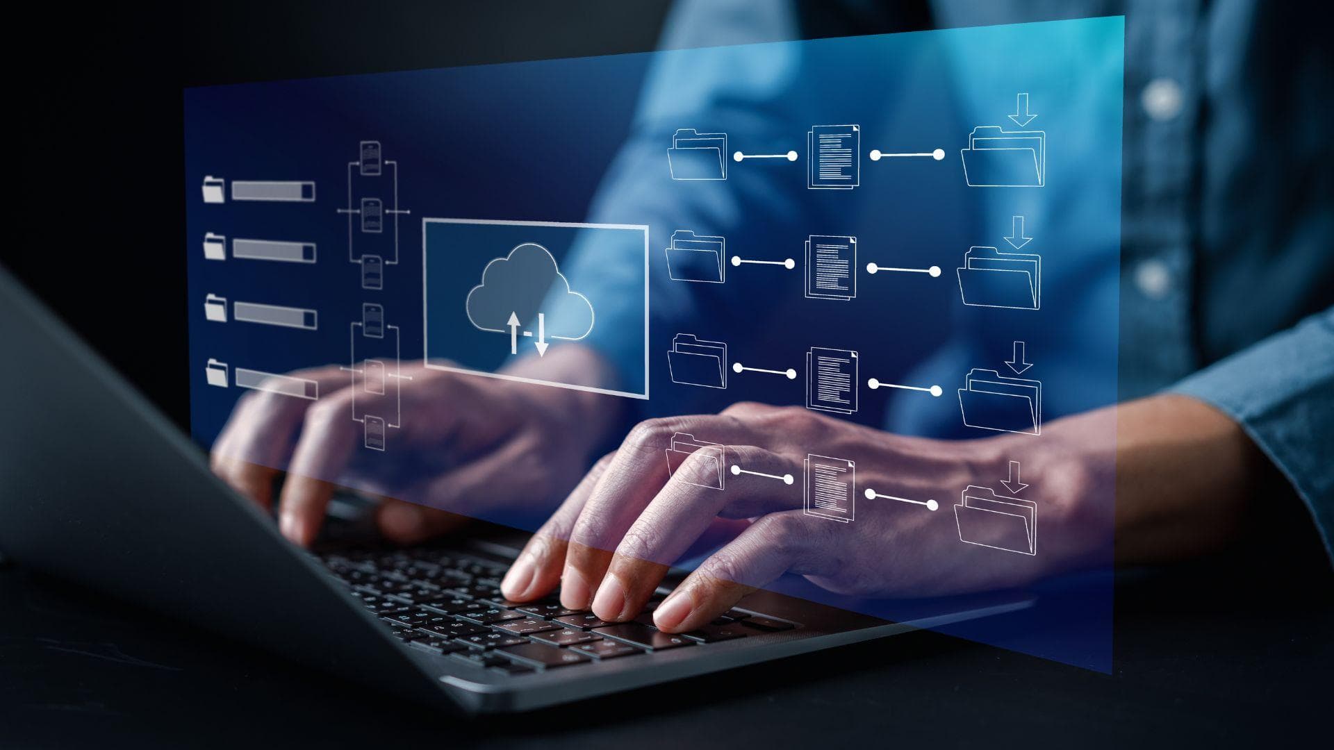 An analyst reviewing data dashboards on screen.